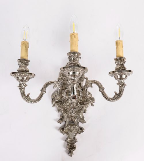 fig 1. A pair of ornate silver-plated French wall sconces with three scrolling candle arms and detailed acanthus leaf decoration.
