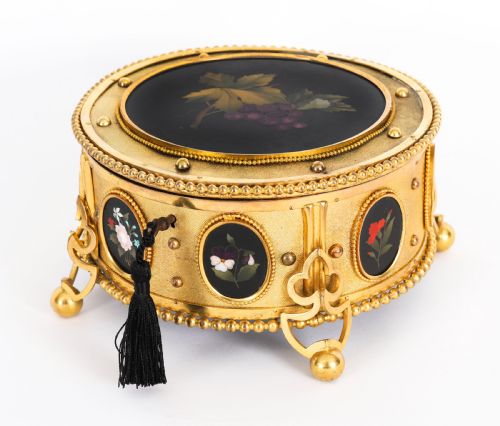 fig 1. A circular 19th-century ormolu jewellery casket featuring fine Pietra Dura floral and fruit stone inlays set into gilt bronze with a key and tassel.
