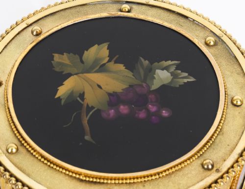 fig 3. A circular 19th-century ormolu jewellery casket featuring fine Pietra Dura floral and fruit stone inlays set into gilt bronze with a key and tassel.