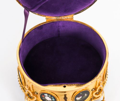 fig 4. A circular 19th-century ormolu jewellery casket featuring fine Pietra Dura floral and fruit stone inlays set into gilt bronze with a key and tassel.
