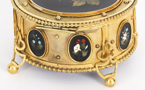 fig 5. A circular 19th-century ormolu jewellery casket featuring fine Pietra Dura floral and fruit stone inlays set into gilt bronze with a key and tassel.