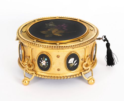 fig 7. A circular 19th-century ormolu jewellery casket featuring fine Pietra Dura floral and fruit stone inlays set into gilt bronze with a key and tassel.