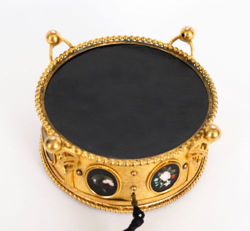 fig 10. A circular 19th-century ormolu jewellery casket featuring fine Pietra Dura floral and fruit stone inlays set into gilt bronze with a key and tassel.