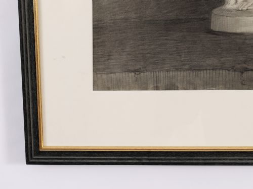 fig 3. A monochrome charcoal drawing depicting a classical male nude sculpture in a black and gold frame with a cream mount.