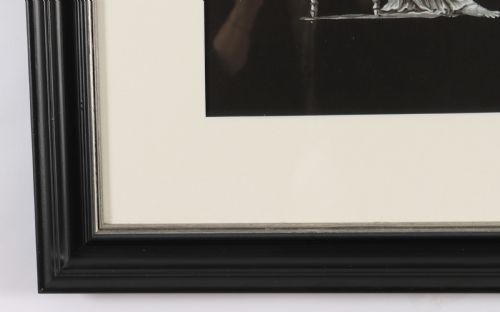 fig 3. A framed monochrome 19th-century gouache painting depicting the mythological figures Venus seated on a classical stool and Cupid standing before her.