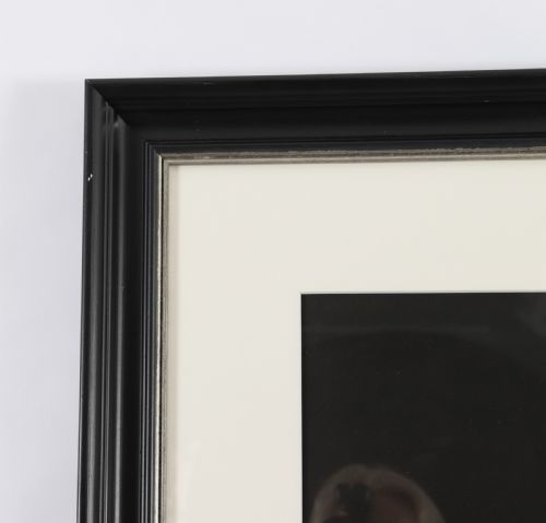 fig 4. A framed monochrome 19th-century gouache painting depicting the mythological figures Venus seated on a classical stool and Cupid standing before her.