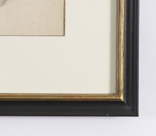 fig 2. A framed late 19th-century graphite drawing on cream paper depicting a male anatomical figural study with an raised arm, set within a black frame featuring a gold inner trim.