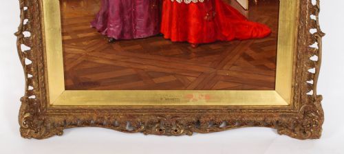 fig 4. A 19th-century oil painting depicting two Catholic clergymen in red and purple robes conversing inside an ornate room, enclosed in a carved gilt frame.