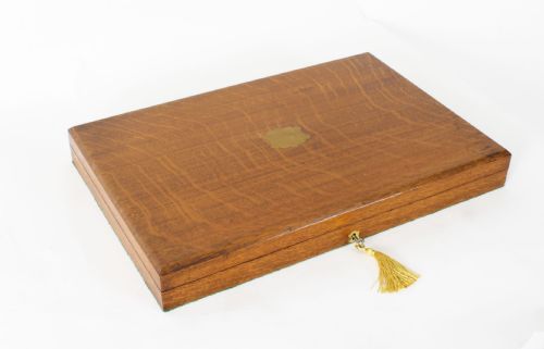 fig 2. A 19th-century Victorian silver-plated carving and serving set with dark stag antler handles, displayed inside a silk and velvet lined wooden canteen box.