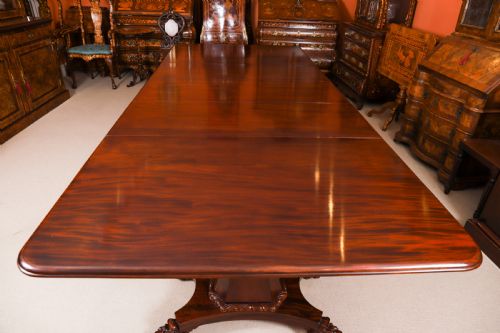 fig 2. An extendable George IV Regency mahogany twin pedestal dining table with carved paw feet.