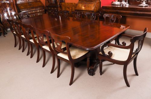 fig 3. An extendable George IV Regency mahogany twin pedestal dining table with carved paw feet.