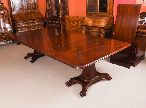 fig 5. An extendable George IV Regency mahogany twin pedestal dining table with carved paw feet.