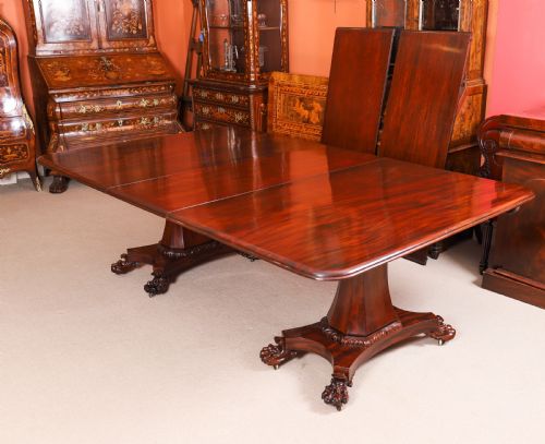 fig 6. An extendable George IV Regency mahogany twin pedestal dining table with carved paw feet.