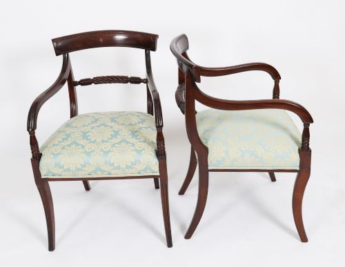 fig 1. A set of eight Regency mahogany dining chairs, including two carvers, featuring curved top rails, rope-twist splats, and pale blue patterned upholstered seats.