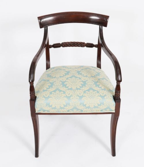fig 3. A set of eight Regency mahogany dining chairs, including two carvers, featuring curved top rails, rope-twist splats, and pale blue patterned upholstered seats.
