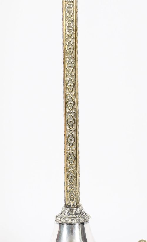 fig 1. A nineteenth-century silver-plated table lamp base with a parcel gilt patterned column and stepped circular foot.
