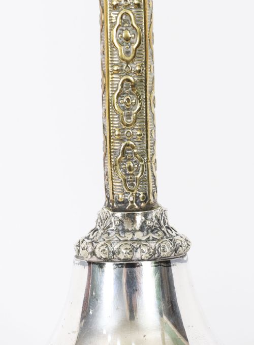 fig 3. A nineteenth-century silver-plated table lamp base with a parcel gilt patterned column and stepped circular foot.