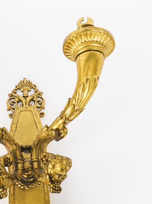 fig 2. A pair of antique French Louis XIV Revival two-branch gilt bronze ormolu wall sconces decorated with cherub motifs.