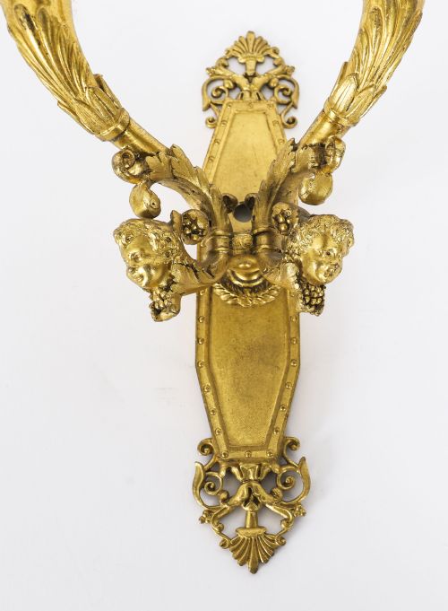 fig 3. A pair of antique French Louis XIV Revival two-branch gilt bronze ormolu wall sconces decorated with cherub motifs.