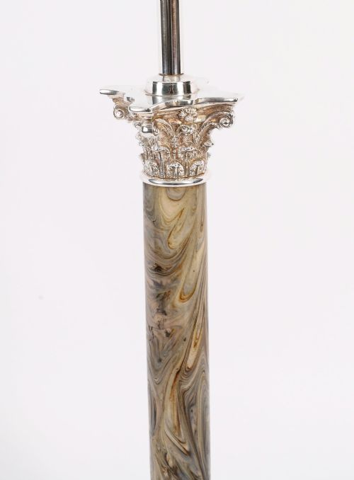 fig 4. A silver-plated Corinthian column table lamp with a marbled shaft set upon a stepped square base.