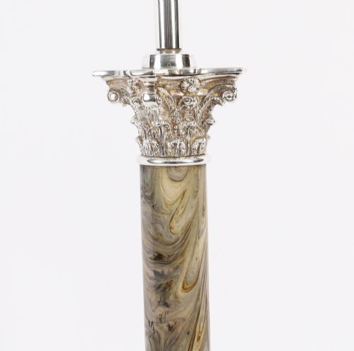 fig 5. A silver-plated Corinthian column table lamp with a marbled shaft set upon a stepped square base.