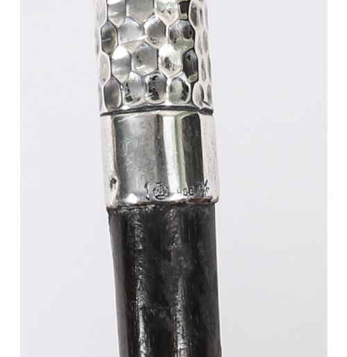 An antique French walking cane featuring a hand-hammered crook-shaped silver handle mounted on a dark wooden shaft. View IX