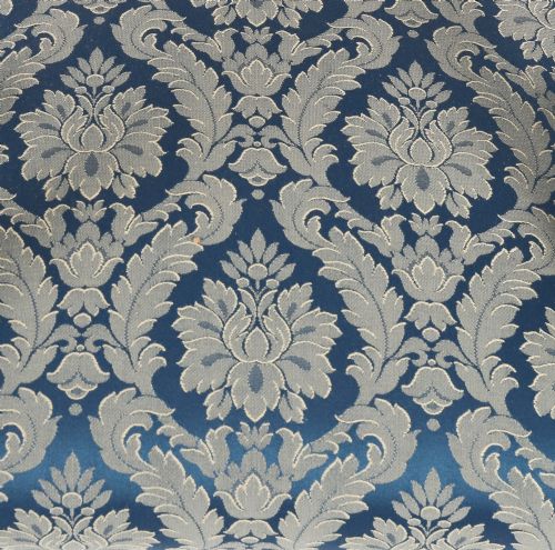 fig 6. A set of eight William IV mahogany barback dining chairs with blue damask patterned fabric upholstery and turned front legs.