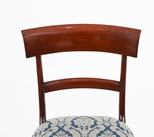 fig 9. A set of eight William IV mahogany barback dining chairs with blue damask patterned fabric upholstery and turned front legs.