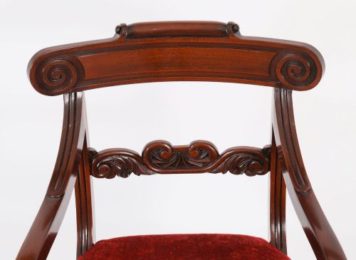 fig 3. A set of ten Regency flame mahogany dining chairs with carved scroll backrails, turned fluted front legs, and red velvet seats.