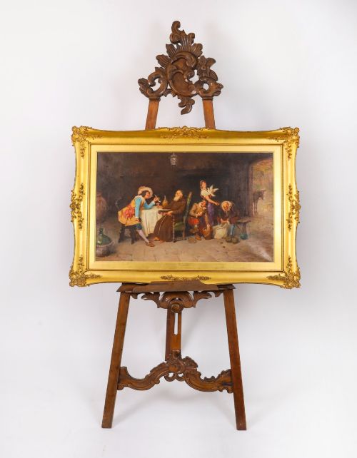 fig 1. A 19th-century carved walnut artist easel featuring an ornate Rococo Revival scrollwork crest and an adjustable ledge on a tripod frame.