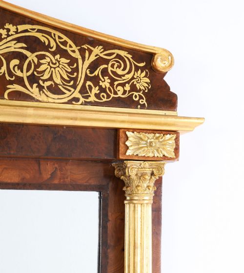 fig 4. A nineteenth-century rectangular French burr walnut mirror featuring gilded fluted pilasters, classical foliate cresting with a central mask motif, and gilt rosettes.