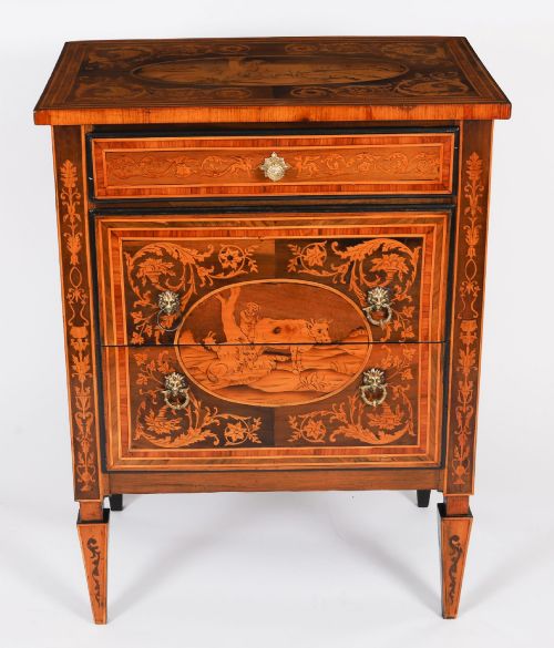 fig 1. An 18th-century Italian Neoclassical walnut commodino featuring intricate foliate and pictorial marquetry inlay, three drawers with lion head ring pulls, and square tapered legs.