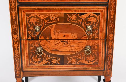 fig 2. An 18th-century Italian Neoclassical walnut commodino featuring intricate foliate and pictorial marquetry inlay, three drawers with lion head ring pulls, and square tapered legs.