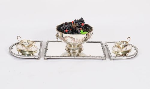 fig 1. A three-piece antique French silver-plated mirrored surtout de table with ornate floral and shell border mouldings.