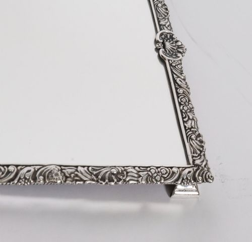 fig 5. A three-piece antique French silver-plated mirrored surtout de table with ornate floral and shell border mouldings.