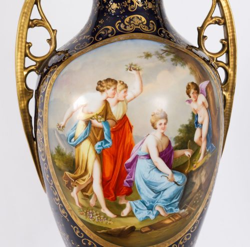 fig 2. A pair of large 19th-century cobalt blue porcelain vases on matching square pedestals, featuring gilt scrollwork and hand-painted classical mythological scenes.