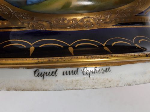 fig 6. A pair of large 19th-century cobalt blue porcelain vases on matching square pedestals, featuring gilt scrollwork and hand-painted classical mythological scenes.