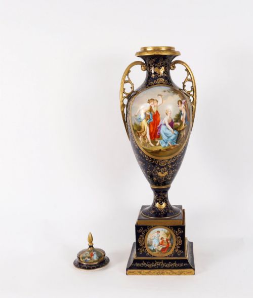 fig 8. A pair of large 19th-century cobalt blue porcelain vases on matching square pedestals, featuring gilt scrollwork and hand-painted classical mythological scenes.