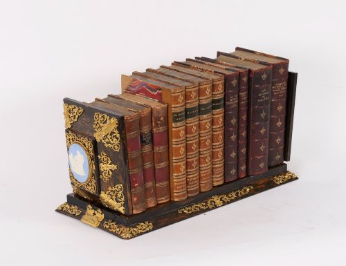 fig 2. A three-piece Victorian coromandel wood desk set featuring gilt ormolu mounts, brass strapwork, and light blue oval jasperware plaques.