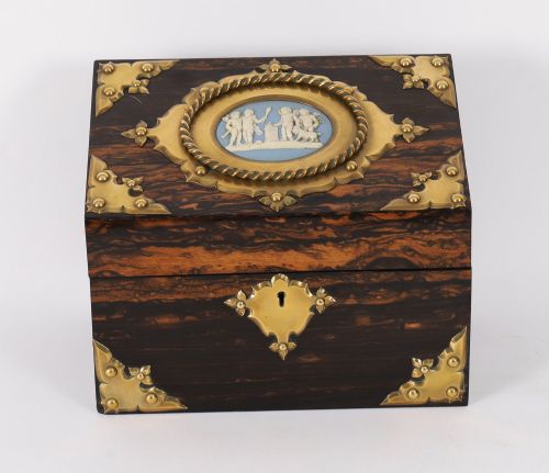 fig 3. A three-piece Victorian coromandel wood desk set featuring gilt ormolu mounts, brass strapwork, and light blue oval jasperware plaques.