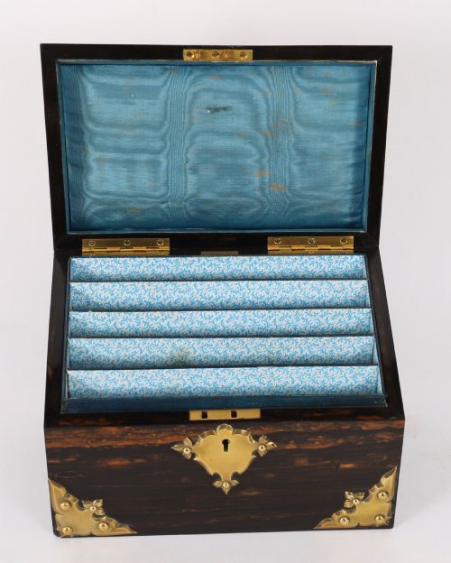 fig 4. A three-piece Victorian coromandel wood desk set featuring gilt ormolu mounts, brass strapwork, and light blue oval jasperware plaques.