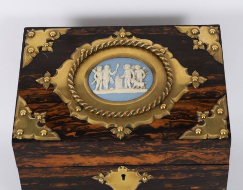 fig 5. A three-piece Victorian coromandel wood desk set featuring gilt ormolu mounts, brass strapwork, and light blue oval jasperware plaques.