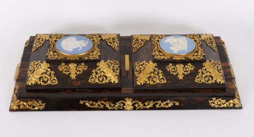 fig 9. A three-piece Victorian coromandel wood desk set featuring gilt ormolu mounts, brass strapwork, and light blue oval jasperware plaques.