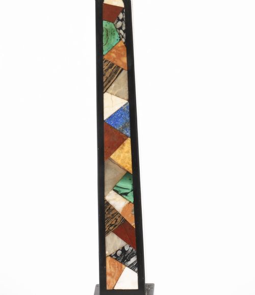 fig 4. A pair of antique black marble obelisks featuring colourful geometric stone inlays along the shaft and floral inlaid detail on stepped square bases.