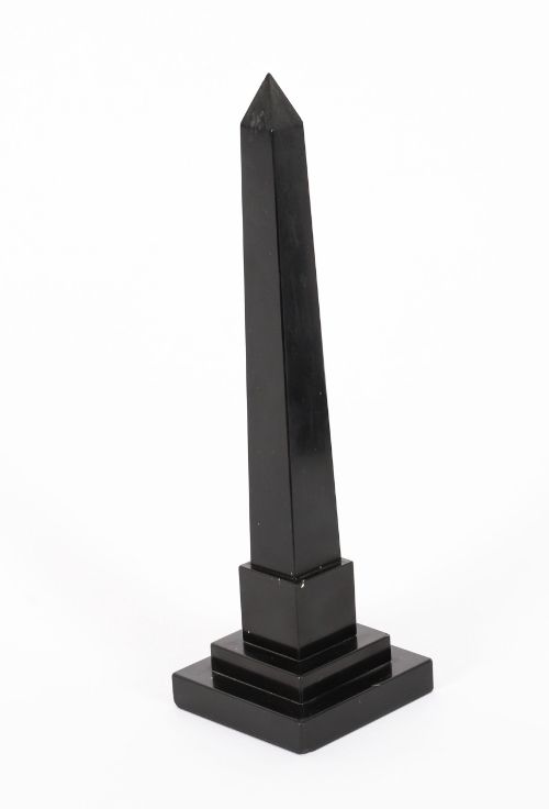 fig 6. A pair of antique black marble obelisks featuring colourful geometric stone inlays along the shaft and floral inlaid detail on stepped square bases.