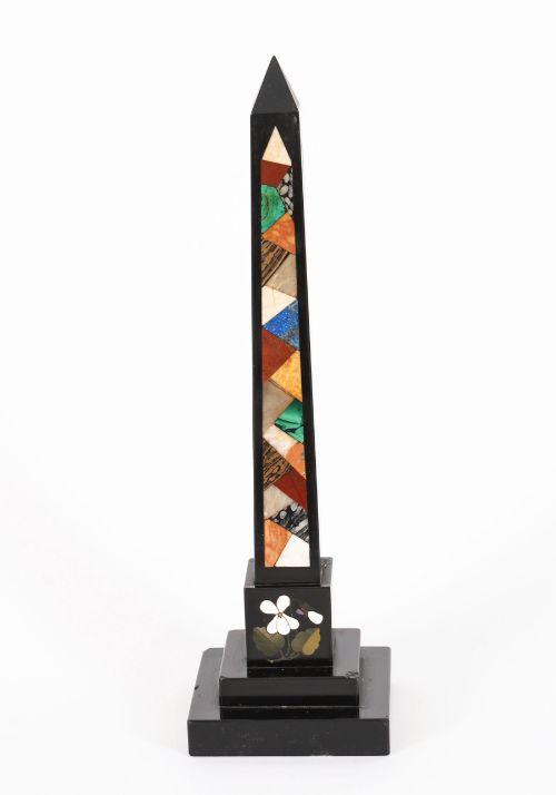 fig 7. A pair of antique black marble obelisks featuring colourful geometric stone inlays along the shaft and floral inlaid detail on stepped square bases.