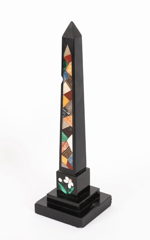 fig 8. A pair of antique black marble obelisks featuring colourful geometric stone inlays along the shaft and floral inlaid detail on stepped square bases.