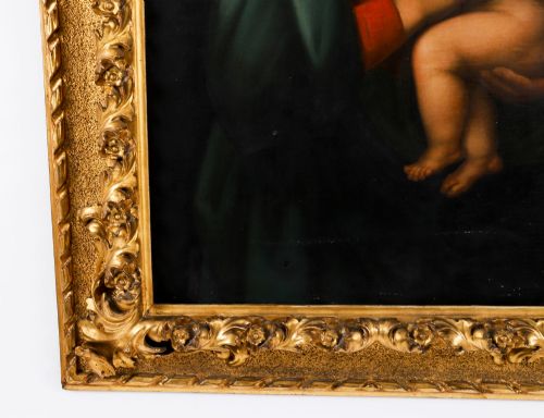 fig 4. An early 19th-century oil painting depicting the Virgin Mary holding the infant Christ, framed in an ornate carved gold leaf frame.