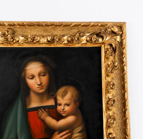 fig 5. An early 19th-century oil painting depicting the Virgin Mary holding the infant Christ, framed in an ornate carved gold leaf frame.