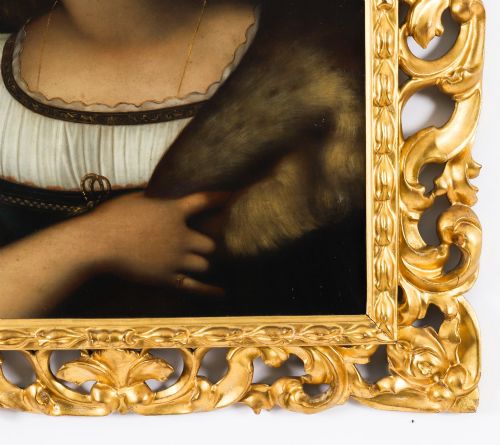 fig 6. An early 19th-century portrait oil painting of a woman in classical attire set within a heavily carved gold giltwood frame.
